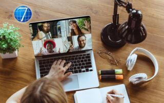 Remote meeting. Woman working from home, remote office concept. Young boss, manager in front of laptop during online conference with colleagues and teams.