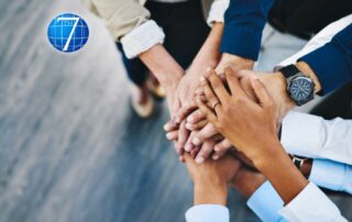 a group of diverse professionals collaborating in a modern office setting, highlighting unity and teamwork. Providing a warm, motivational tone to emphasize the theme of leveraging individual strengths within a team.