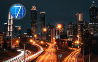 An illuminated cityscape at night with dynamic light trails from vehicles, symbolizing progress and adaptation, reflecting the essence of leadership strategies in navigating and thriving amidst disruption.