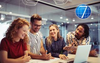 Team of professionals collaborating in a modern office, representing trust and overcoming impostor syndrome in leadership through teamwork and confidence-building.